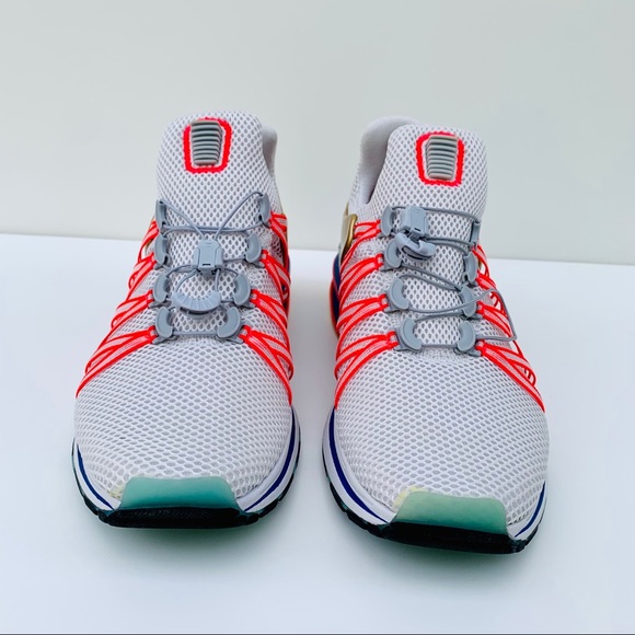 nike shox gravity vast grey metallic gold